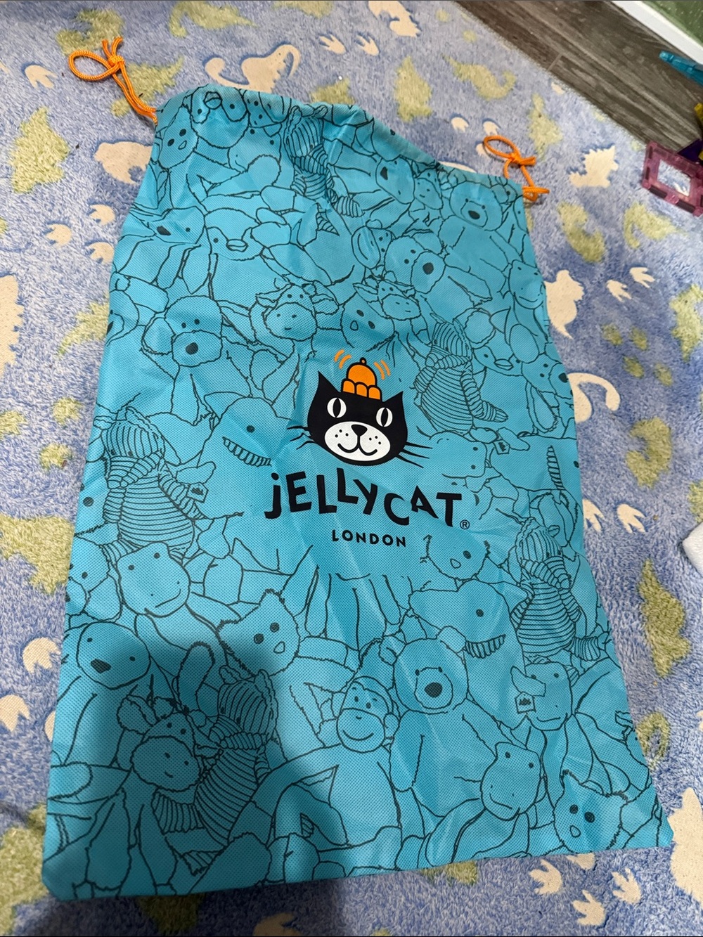 Jellycat Teal Drawstring Toy Bag with Black Logo and Orange Cord